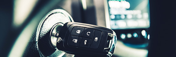 car ignition key with remote buttons and dashboard display showing vehicle information five key functions of modern keys