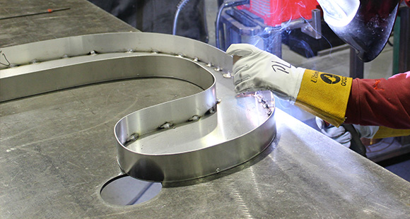 worker welding metal piece in workshop 7 techniques for welding excellence