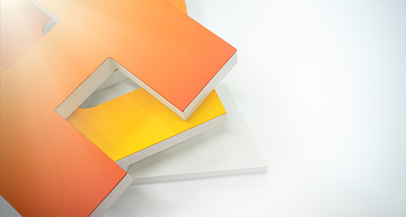 colorful stacked letters in orange and yellow two playful designs