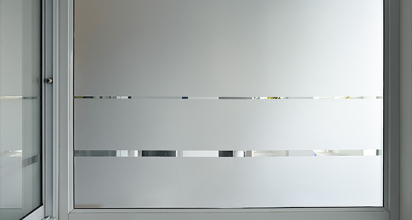 frosted glass window with striped design privacy and modern aesthetics