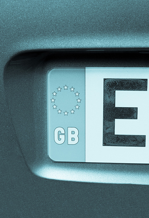 European car license plate displaying the letters E and GB with three stars indicating country code